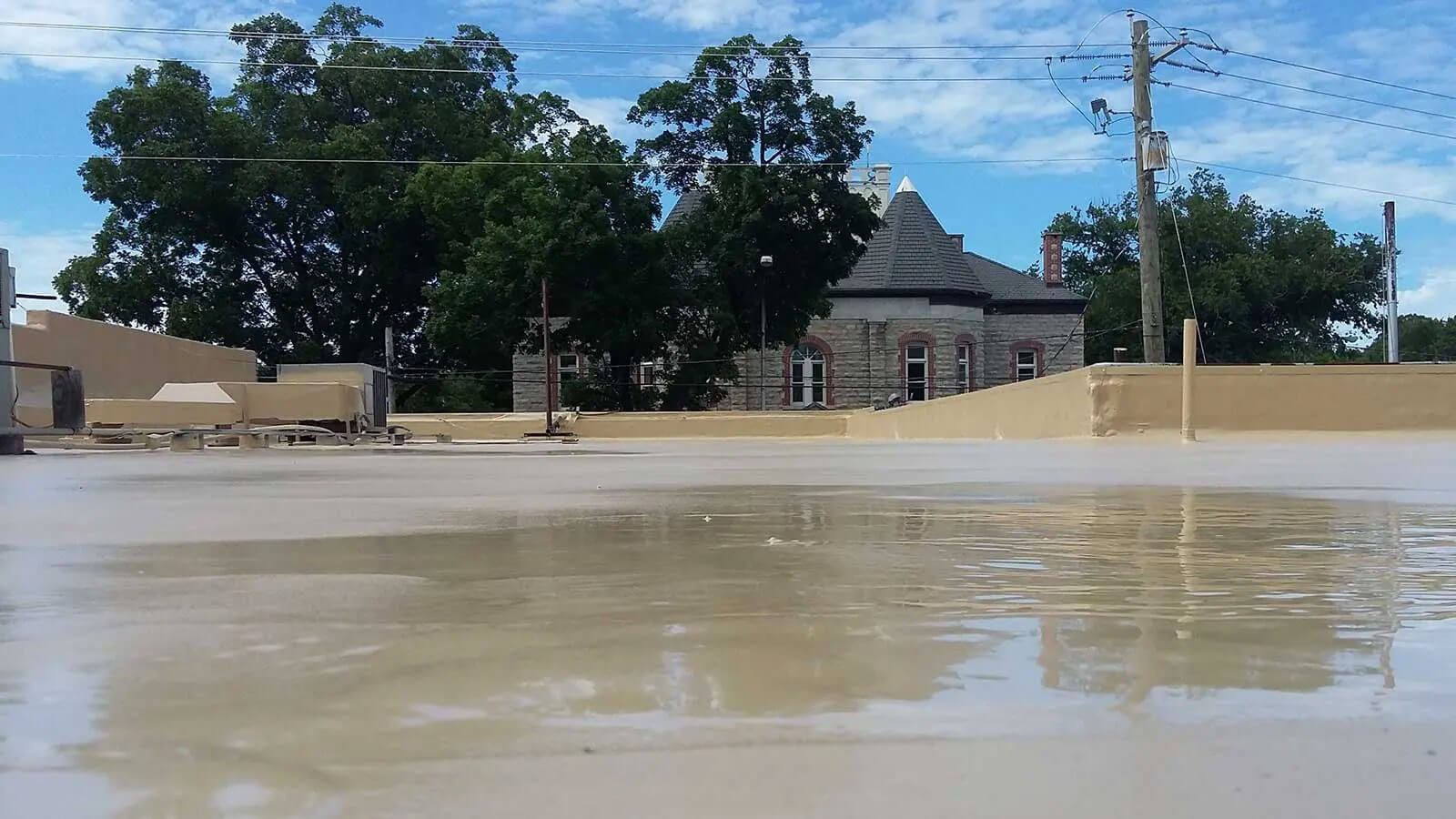 Commercial flat roof restoration with polyurea coating — project 1